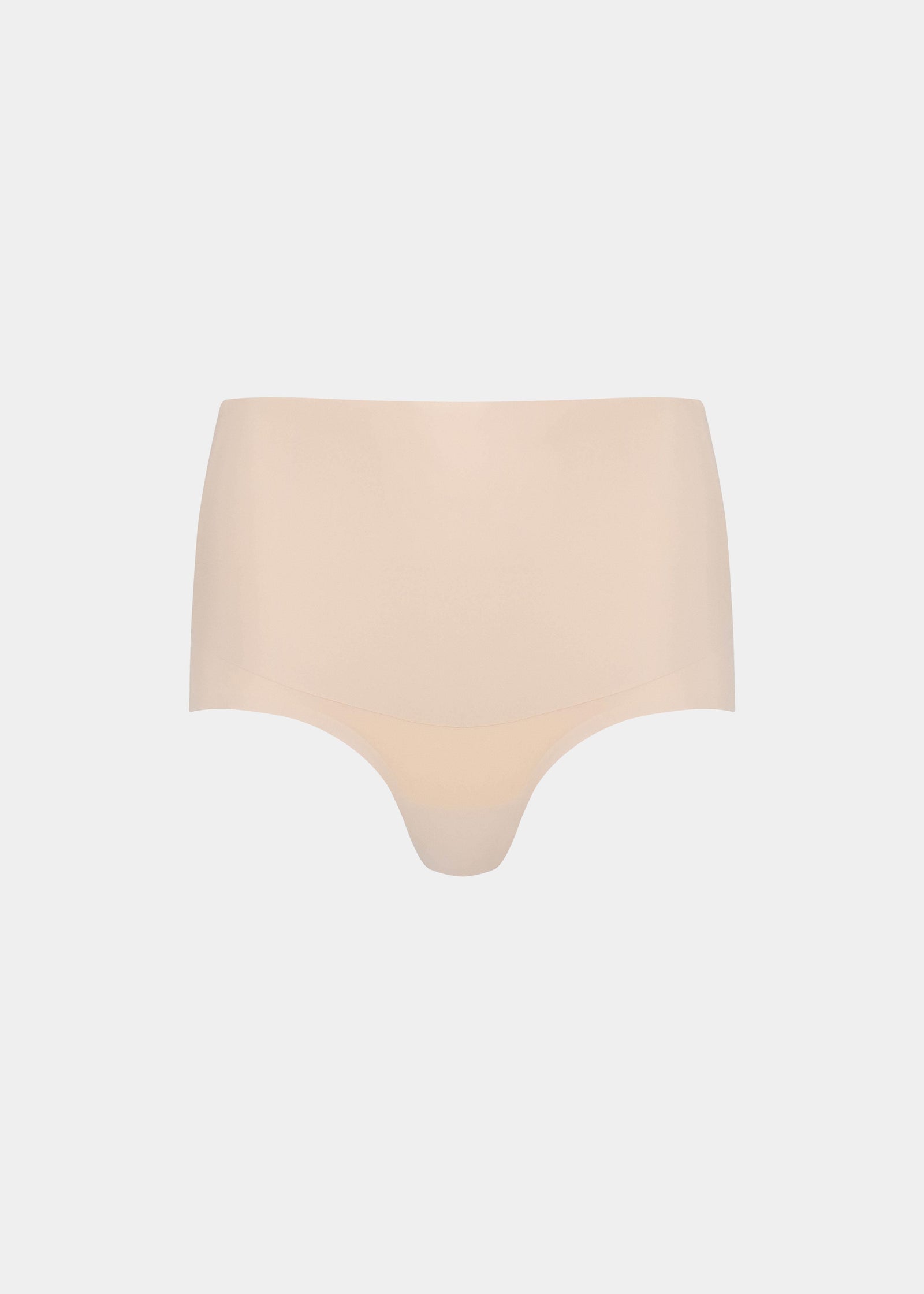 Still product image of Tummy Shaper in latte, mid-waist shaping brief with double-layer smoothing waistband. Seamless design with smooth fabric, full front coverage, and invisible edges for firm tummy shaping.