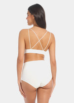 Back view of a model wearing Tummy Shaper in barista, mid-waist shaping brief with seamless design. Smooth fabric with full back coverage and invisible edges, providing firm shaping at the lower back.