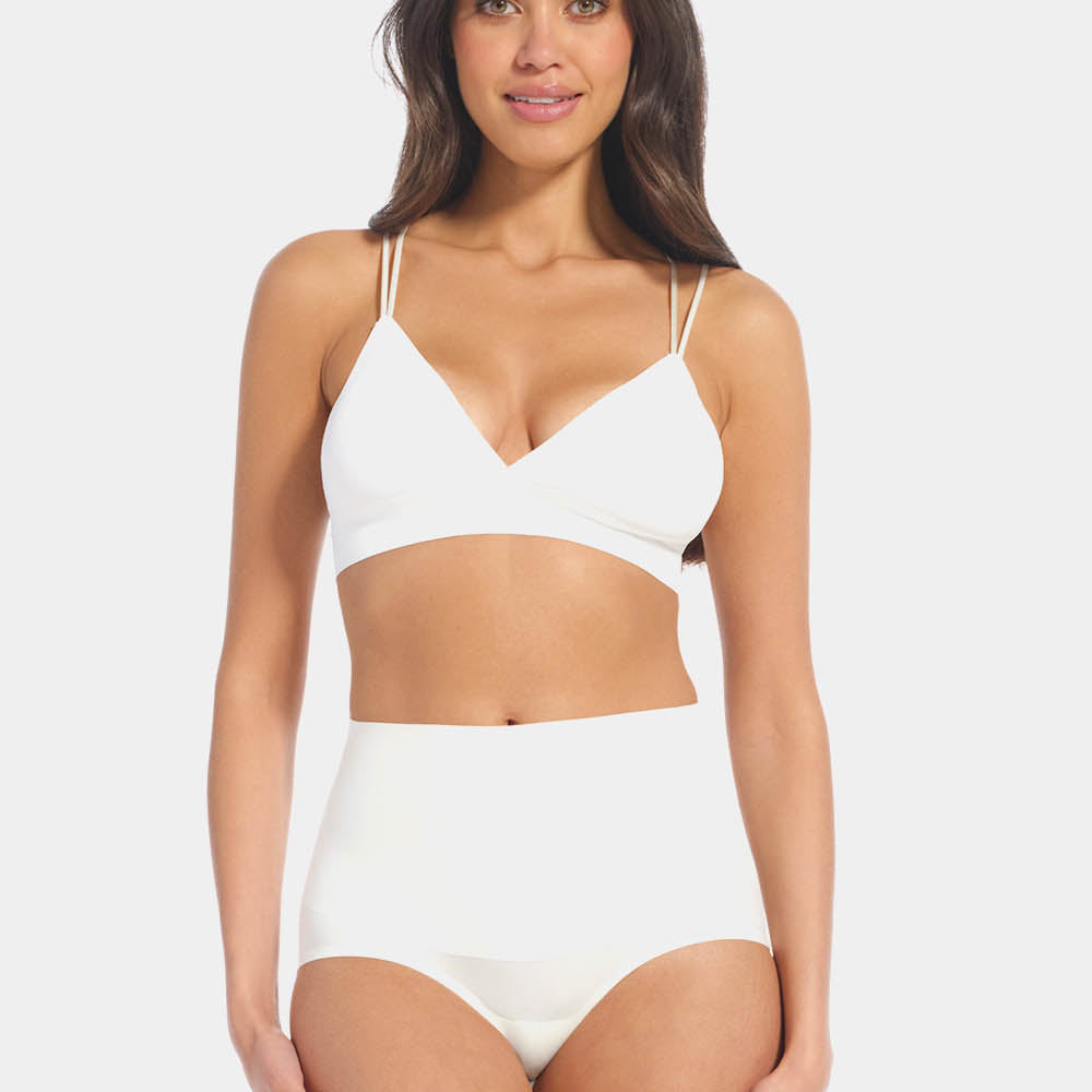 Front view of a model wearing Tummy Shaper in barista, mid-waist shaping brief with double-layer waistband. Seamless design with smooth fabric and full front coverage, providing firm shaping at the tummy area.