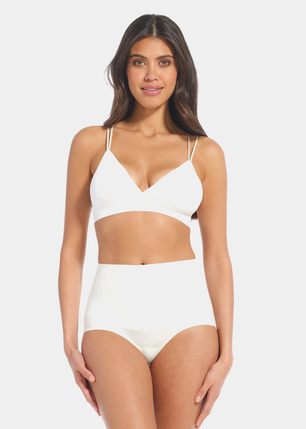 Front view of a model wearing Tummy Shaper in barista, mid-waist shaping brief with double-layer waistband. Seamless design with smooth fabric and full front coverage, providing firm shaping at the tummy area.