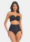 Front view of a model wearing Tummy Shaper in black, mid-waist shaping brief with double-layer waistband. Seamless design with smooth fabric and full front coverage, providing firm shaping at the tummy area.