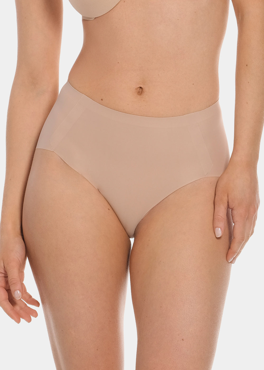 Front view of a model wearing Everyday Shaper Brief in cappuccino, mid-waisted seamless shapewear brief. Smooth, lightweight fabric with seamless waistband and full front coverage, designed for light tummy shaping and invisible wear under clothing.