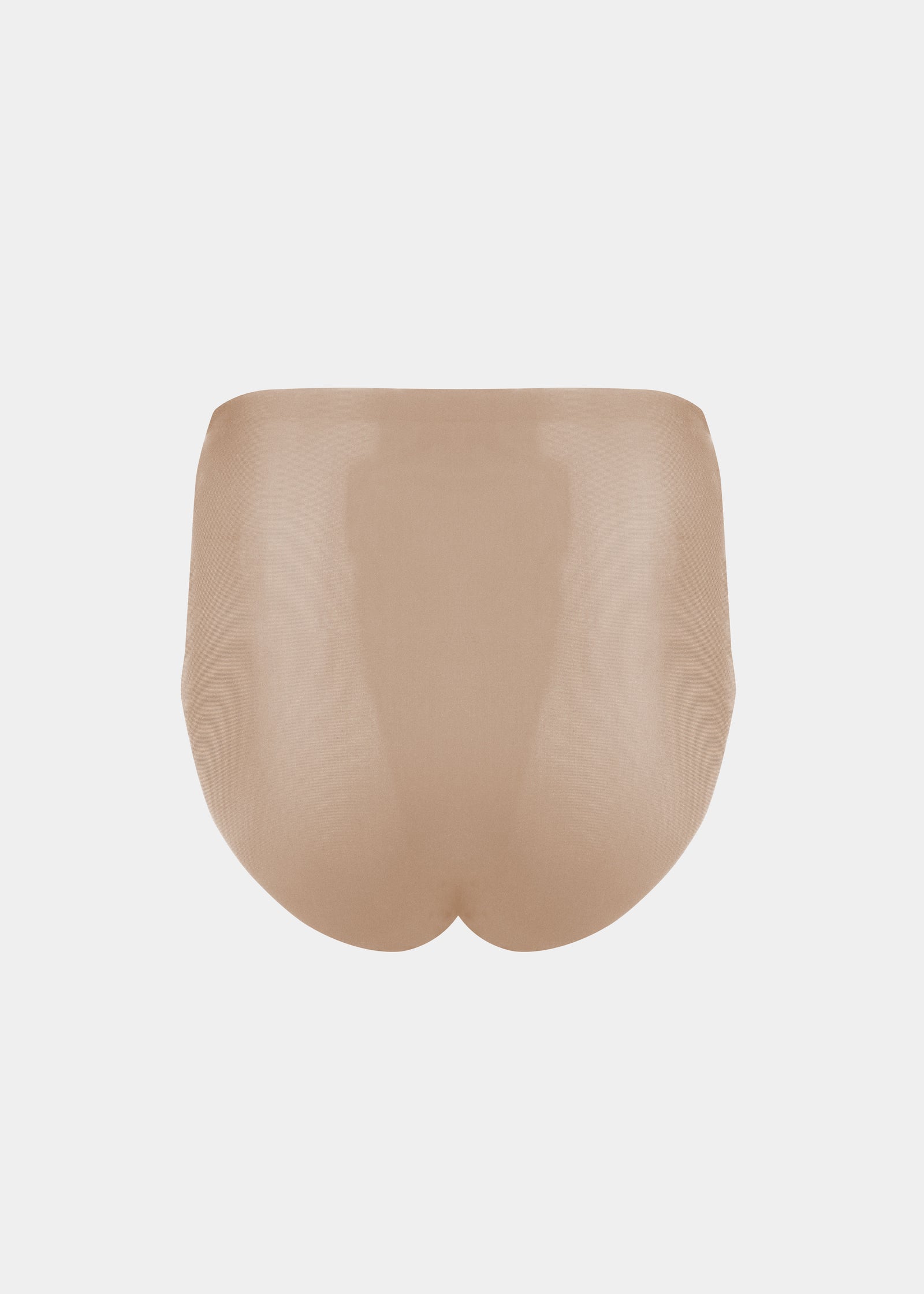 Still product image of Everyday Shaper Shorty in beige shown from the back. Mid-waisted seamless shapewear shorts with smooth fabric, short legs, and seamless edges for invisible shaping under clothing.