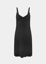 Still product image of Everyday Underdress in black, lightweight underdress with V-neckline and adjustable straps. Smooth, flowy fabric with relaxed fit and mid-thigh length, designed as an invisible base layer under clothing.