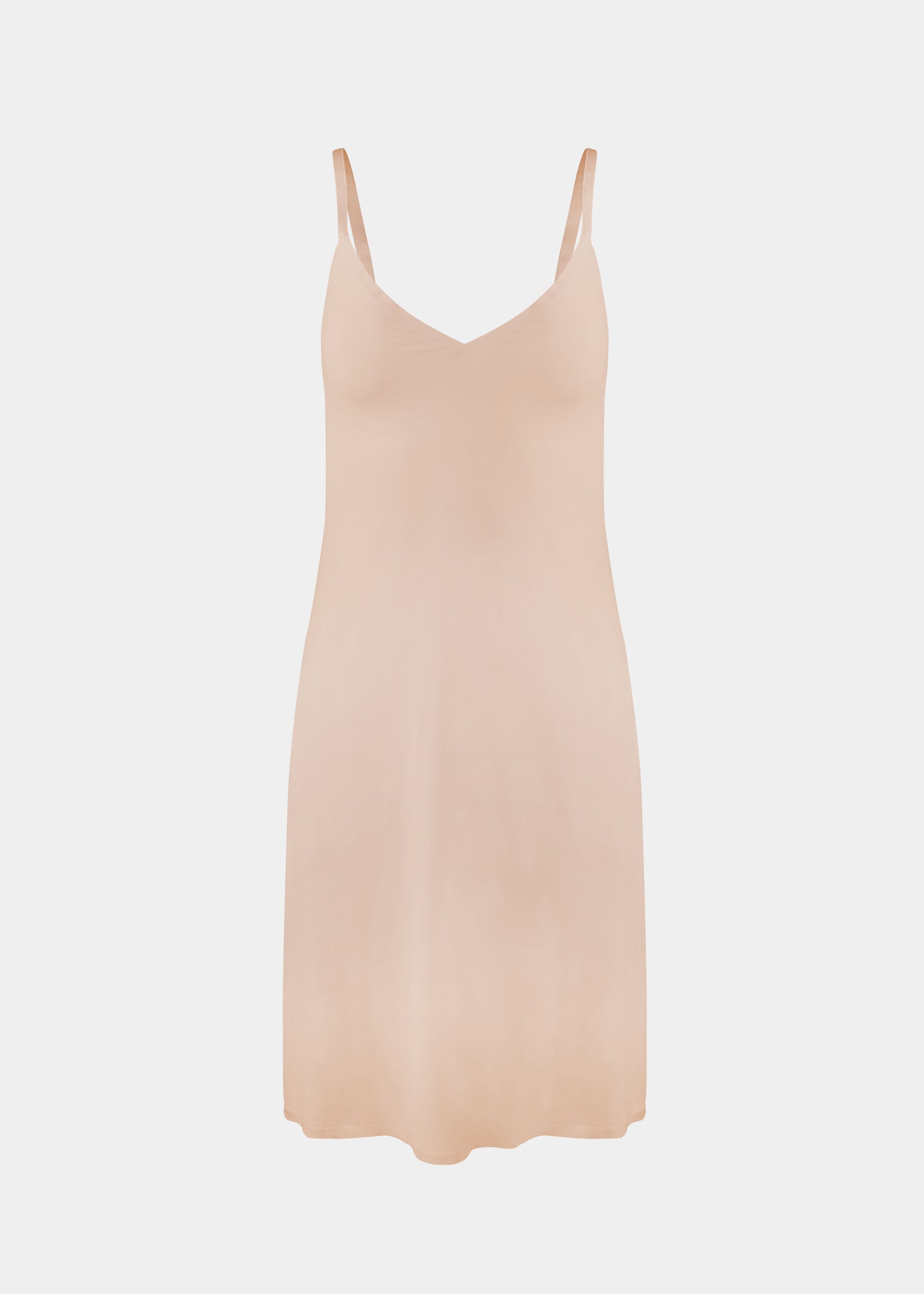 Still product image of Everyday Underdress in cappuccino, lightweight underdress with V-neckline and adjustable straps. Smooth, flowy fabric with relaxed fit and mid-thigh length, designed as an invisible base layer under clothing.