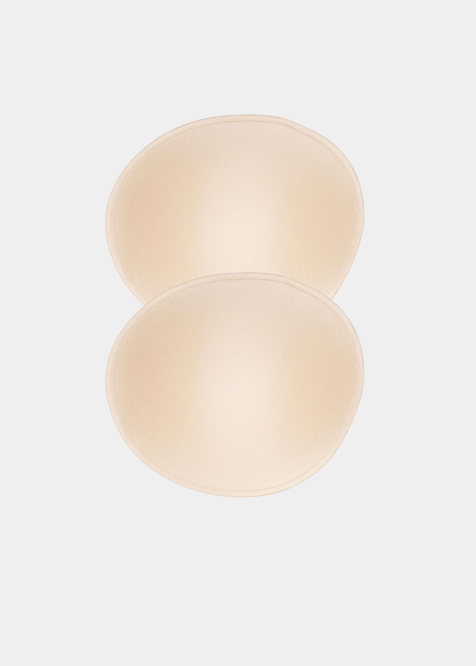 Still product image of MAGIC Cups in latte showing the inside surface. Soft interior with smooth finish and seamless edges, designed for placement inside bras or garments to shape the breast.