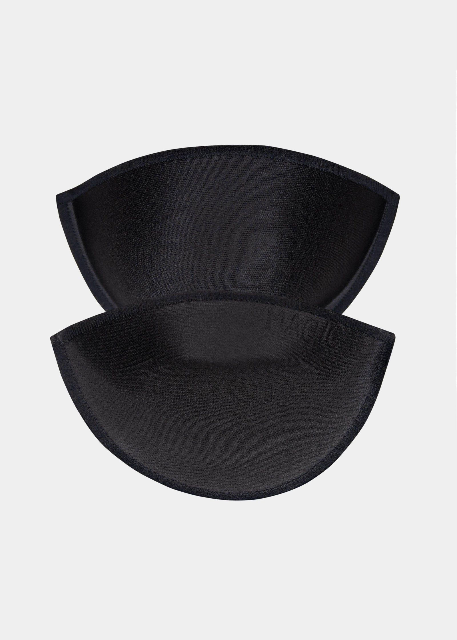 Still product image of Watersoft Push-Up Bra pads in black, water and oil-filled silicone inserts. Two full cup pads shown overlapping, with smooth surface, rounded shape, and seamless edges visible.