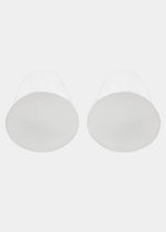 Still product image of MAGIC Lift-it’s in clear, adhesive silicone lifting cups with extended upper lifting tabs. Transparent seamless cups with smooth surface and visible adhesive interior for strapless, backless breast lift.