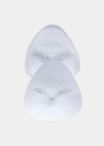 Still product image of Bikini Swim Pad in clear, silicone adhesive push-up pads. Transparent pads with smooth surface and curved shape, designed for use inside bikini or swimwear to add lift and volume.