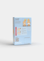 Still product image of Silicone Curves in clear shown from the back of the packaging box. Rectangular box displaying product information, illustrations of pad placement, and usage details on the back panel.
