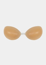 Still product image of Amazing Bra in latte, strapless adhesive silicone bra with two seamless cups and center front closure. Smooth matte finish with curved cup shape and no straps or back band visible.