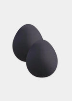 Still product image of the black Beverly Hills Secret breast lift tapes, showcasing the ultra-thin adhesive tape pieces designed to lift and support the bust for an invisible finish.