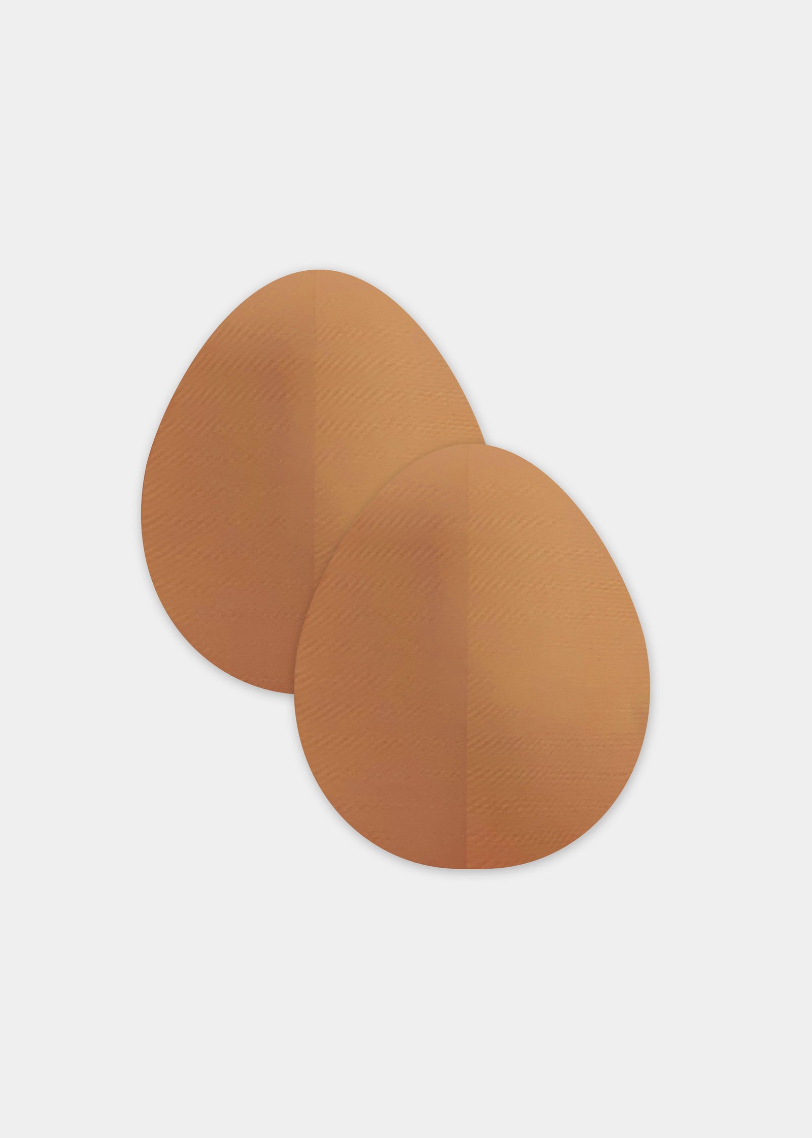 Still product image of the mocha-colored Beverly Hills Secret breast lift tapes, showcasing the ultra-thin adhesive tape pieces designed to lift and support the bust for an invisible finish under clothing.
