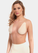 Front view of a model wearing the latte-colored Beverly Hills Secret breast lift tapes, showcasing the ultra-thin adhesive tapes that lift and support the bust while creating a smooth, invisible look under clothing.