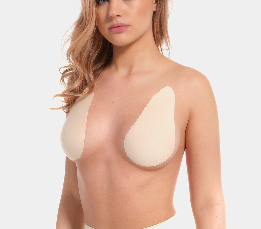 Front view of a model wearing the latte-colored Beverly Hills Secret breast lift tapes, showcasing the ultra-thin adhesive tapes that lift and support the bust while creating a smooth, invisible look under clothing.