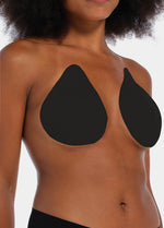 Front view of a model wearing the black Beverly Hills Secret breast lift tapes, showcasing the ultra-thin adhesive tapes that lift and support the bust while creating a smooth, invisible look under clothing.