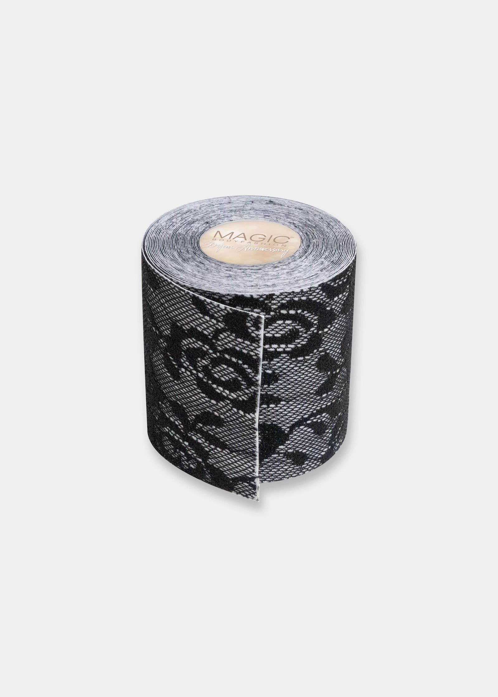 Still product image of the black Luxury Lace Boob Tape rolled up, showcasing the lace-textured adhesive tape on a roll designed to lift and shape the bust.