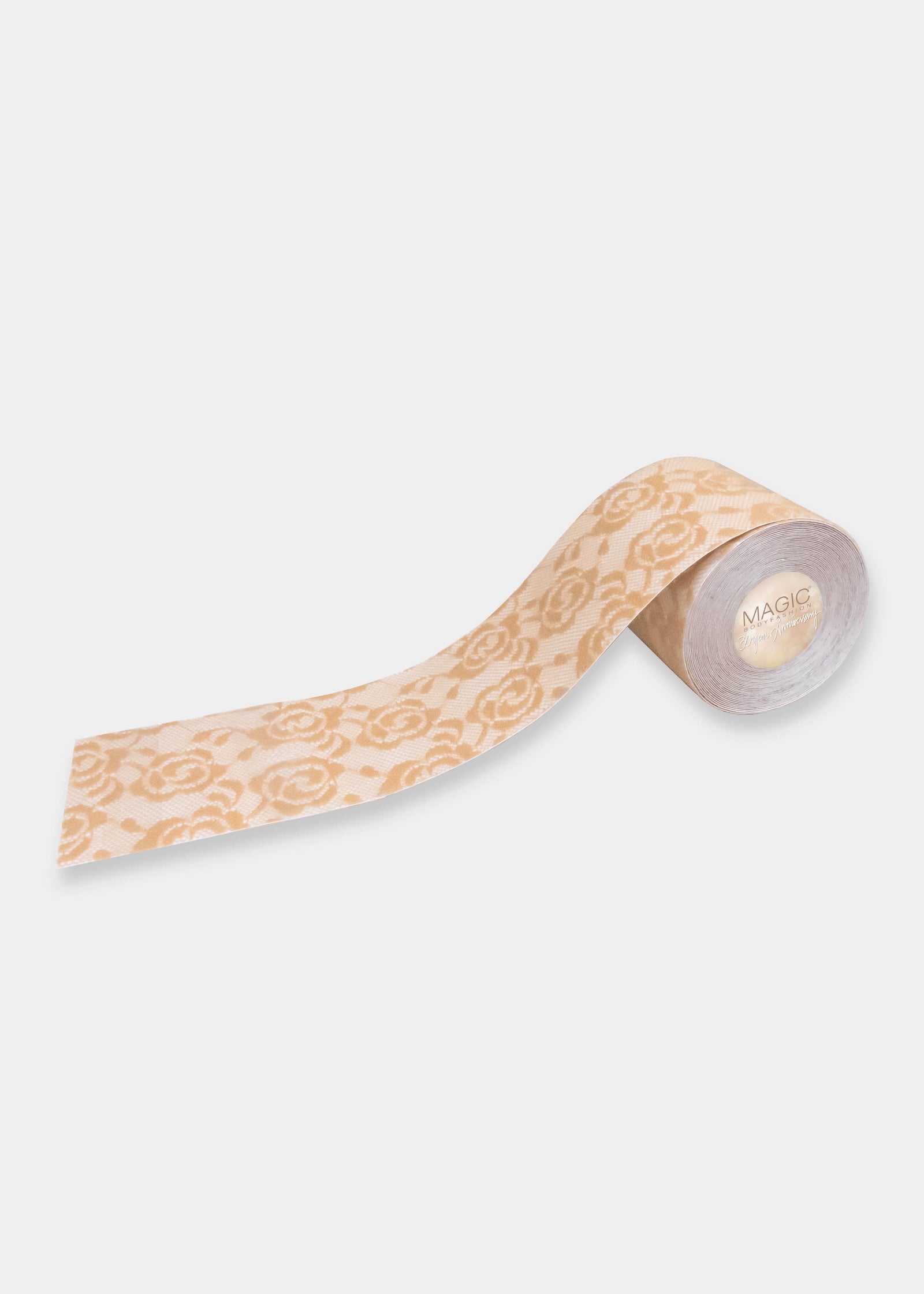Still product image of the caramel-colored Luxury Lace Boob Tape rolled up, showcasing the lace-textured adhesive tape designed to lift and shape the bust.
