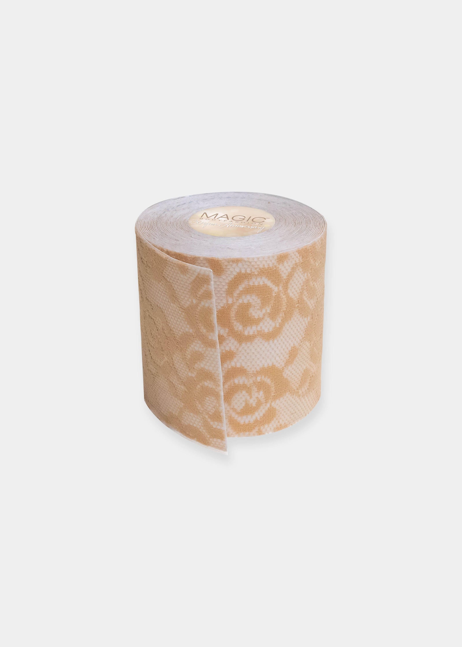 Still product image of the caramel-colored Luxury Lace Boob Tape rolled up, highlighting the lace-textured adhesive tape on a roll for lifting and shaping the bust.
