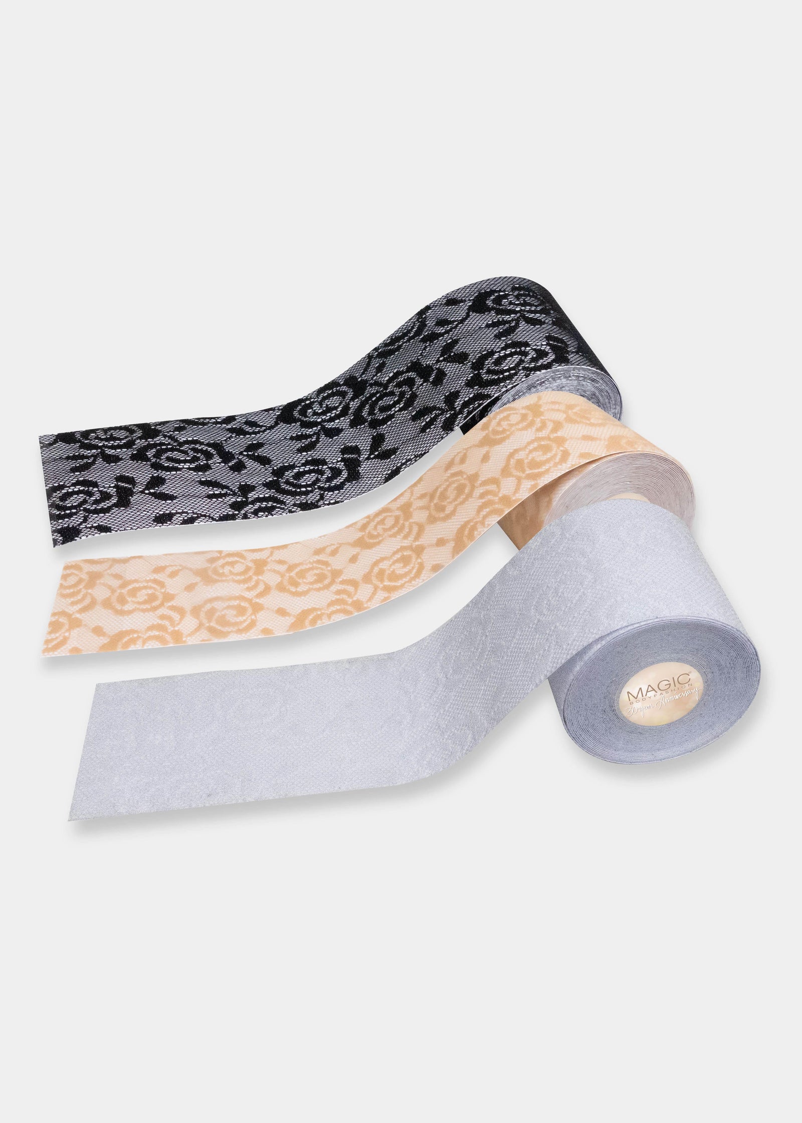 Still product image of the Luxury Lace Boob Tape rolls in multiple colors, showcasing the lace-textured adhesive tape rolls designed to lift and shape the bust.