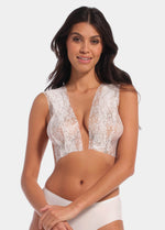 Front view of a model wearing the white Luxury Lace Boob Tape, showcasing the lace-finish adhesive tape applied to lift and shape the bust while creating an elegant, invisible look under clothing.