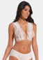 A woman wearing a white lace boob tape that lifts and shapes the breasts, suitable for under strapless or backless outfits.