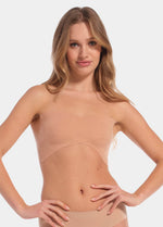 This image features a model wearing the Boob Tape XL, which is designed to provide seamless coverage under clothing. The tape appears beige and is applied horizontally across the chest area to secure a strapless bra or bandeau.