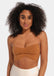 A woman wearing a mocha strapless top made with adhesive boob tape.