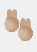 Still front product view of the caramel-colored Lift Covers, showcasing the smooth lifting nipple covers with adhesive support tabs and a seamless finish for invisible coverage.