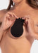 A lift cover being applied to a woman's chest to demonstrate usage