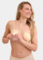 Front view of a model applying the latte-colored Double Sticky Boob Tape to her breast, showing how the double-sided adhesive tape lifts and supports the bust while creating an invisible look under clothing.