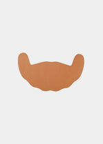 Still product image of Freedom Form in mocha, adhesive breast tape strips. Skin-toned waterproof lifting strips with smooth surface and curved shape, designed for strapless and backless support without straps or closures visible.