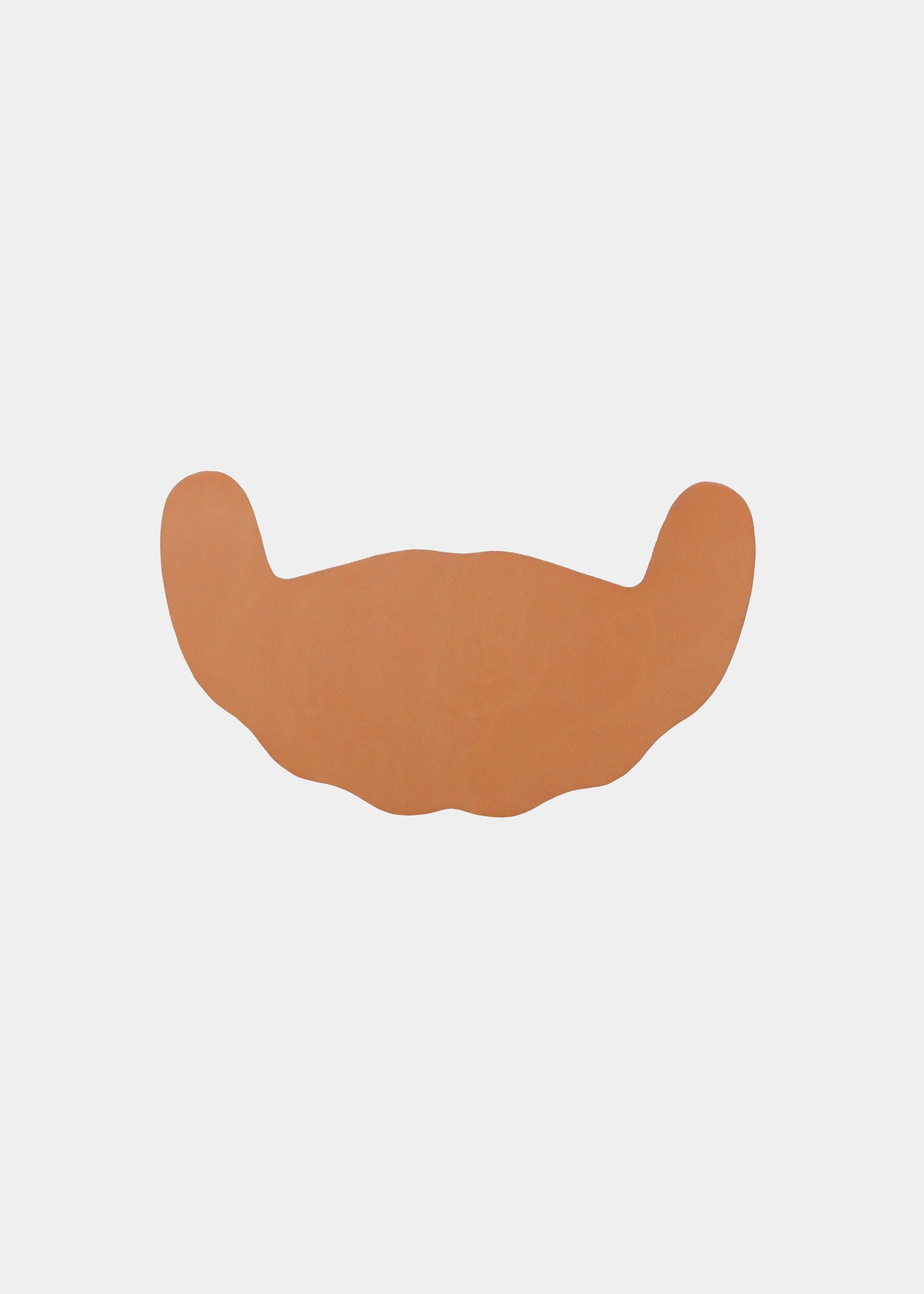 Still product image of Freedom Form in mocha, adhesive breast tape strips. Skin-toned waterproof lifting strips with smooth surface and curved shape, designed for strapless and backless support without straps or closures visible.