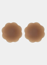 Still product image of Flower Nipples in mocha, flower-shaped silicone nipple covers showing the inside surface. Smooth silicone interior with molded center and seamless edges, designed to create a vacuum effect over the nipple area.