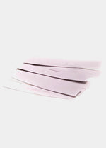 Still product image of the clear MAGIC Fashion Tape strips, showcasing multiple transparent double-sided adhesive pieces designed to keep clothing securely in place.