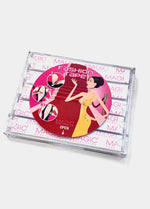 Still product image of the MAGIC Fashion Tape travel case, showing the clear storage box with multiple transparent adhesive tape strips inside.