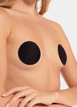 Front view of a model wearing the black MAGIC Hide Your Nipples covers, showcasing the soft fabric nipple covers that provide smooth, discreet coverage with a natural, invisible look under clothing.