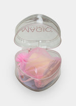 Heart-shaped box with all types of tape inside on a white background