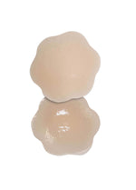 Still product image of the latte-colored Silicone Nipple Covers, displayed to show both the front and back, highlighting the smooth outer surface and the inner skin-friendly adhesive layer with ultra-thin edges for an invisible finish.