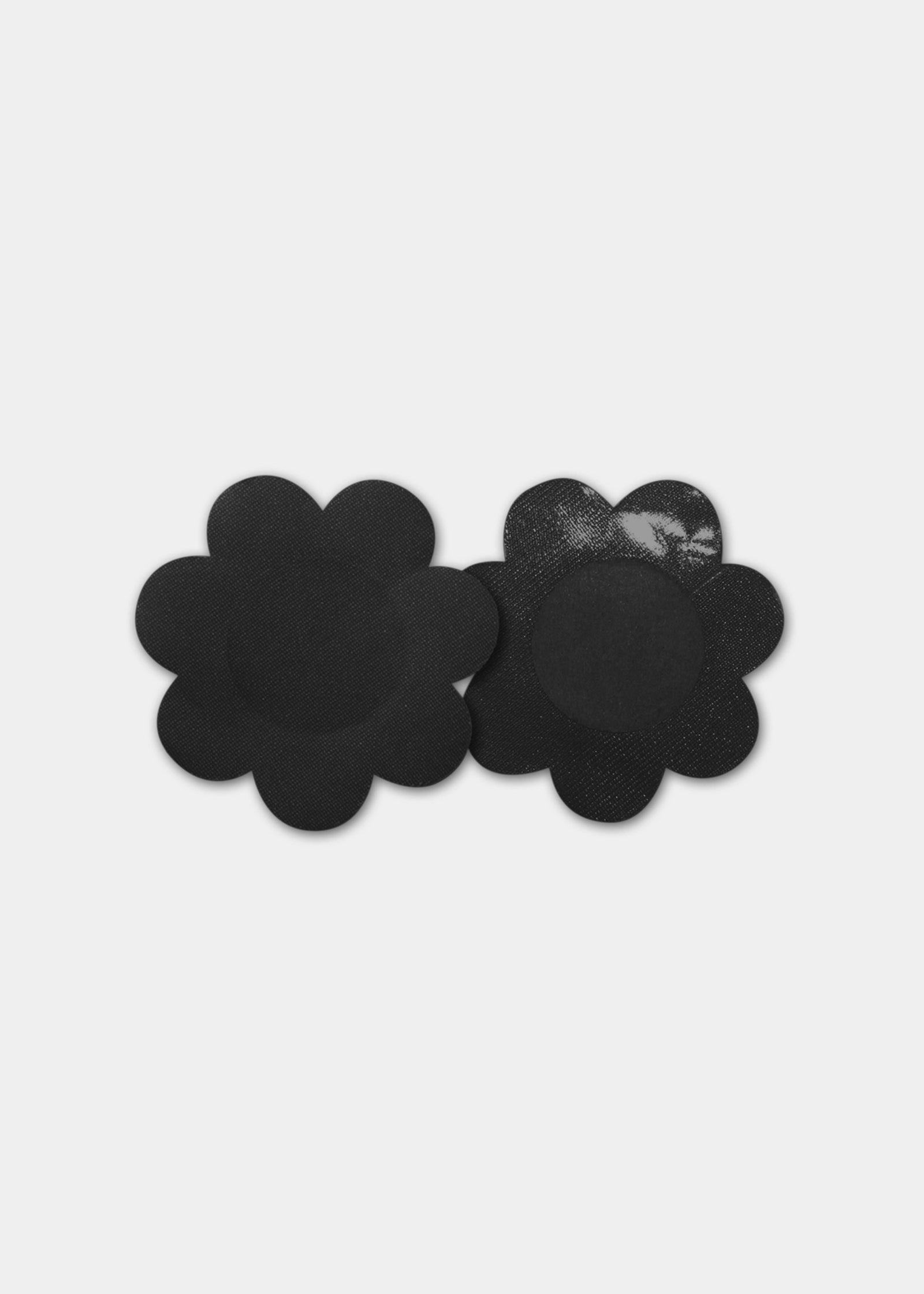 Still product image of the black Secret Covers, displayed to show both the front and back, highlighting the smooth outer surface and the soft inner layer for discreet, invisible coverage.