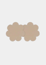 Front view of a model wearing the caramel-colored Secret Covers, featuring soft, flexible nipple covers that provide smooth, discreet coverage with a natural, invisible look under clothing.