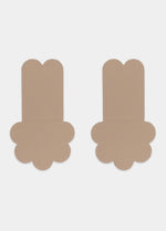 Still front product view of the caramel-colored Secret Lift Covers, showcasing the thin lifting nipple covers with adhesive support tabs and a smooth outer surface for an invisible finish.