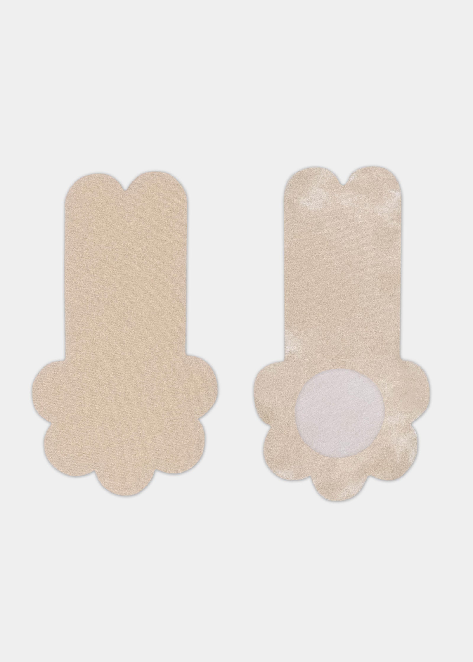 Still product image of the latte-colored Secret Lift Covers, displayed to show both the front and back, highlighting the smooth outer surface and the inner design with an adhesive-free center area for comfortable nipple coverage and lift.