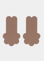 Still front product view of the mocha-colored Secret Lift Covers, showcasing the thin lifting nipple covers with adhesive support tabs and a smooth outer surface for an invisible finish.