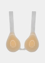 Still back product view of the latte-colored Shapely Bra, showing the transparent lifting straps attached to the silicone cups and the smooth adhesive backing designed for secure, invisible support.