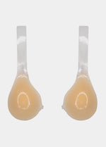 Still back product view of the latte-colored Shapely Bra with the front closure open, showing the separate silicone cups and transparent lifting straps with adhesive backing for invisible support.