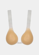 An adhesive bra with two silicone cups and transparent lifting straps, designed for strapless and backless outfits.