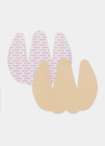 Still product image of the latte-colored Sculpting Breast Tape, showing overlapping adhesive tape pieces designed to lift and support the bust, with a smooth finish and skin-friendly adhesive.