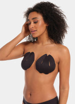 Front view of a model wearing the black Sculpting Breast Tape, showing how the adhesive tape lifts and supports the bust while keeping the shoulders, back, and cleavage free for an invisible look under clothing.