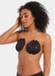 Front view of a model wearing the black Sculpting Breast Tape, showing how the adhesive tape lifts and supports the bust while keeping the shoulders, back, and cleavage free for an invisible look under clothing.